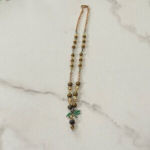 Elegant Beaded Necklace with Gold and Green Accents hand made